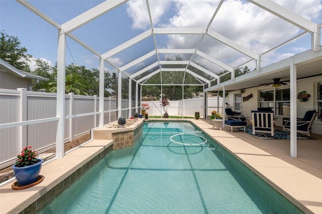 11021 4th Ave E, Bradenton, FL 34212 - view of swimming pool with ceiling fan, a fenced backyard, glass enclosure, and a patio area