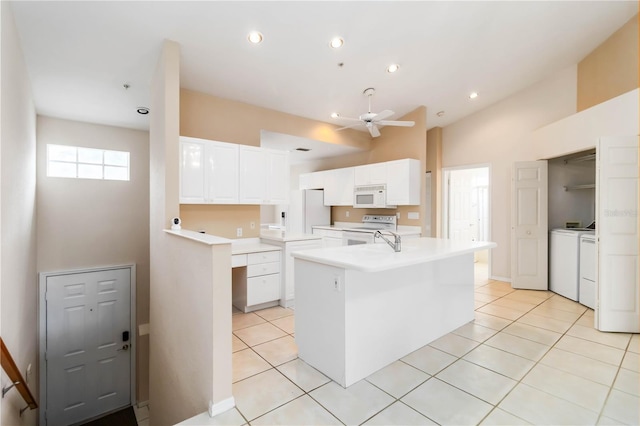 6572 Fairway Gardens Dr Unit 6572, Bradenton, FL 34203 - kitchen featuring white appliances, washing machine and dryer, a ceiling fan, light tile patterned floors, and recessed lighting
