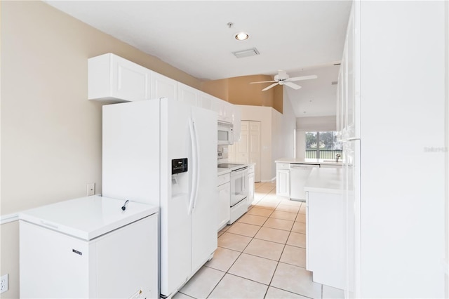 6572 Fairway Gardens Dr Unit 6572, Bradenton, FL 34203 - kitchen featuring white appliances, ceiling fan, white cabinets, light tile patterned floors, and light countertops