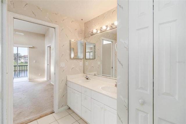 6572 Fairway Gardens Dr Unit 6572, Bradenton, FL 34203 - bathroom with double vanity, tile patterned flooring, and baseboards