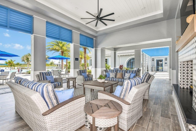 view of patio with an outdoor living space, a ceiling fan, and outdoor dining space