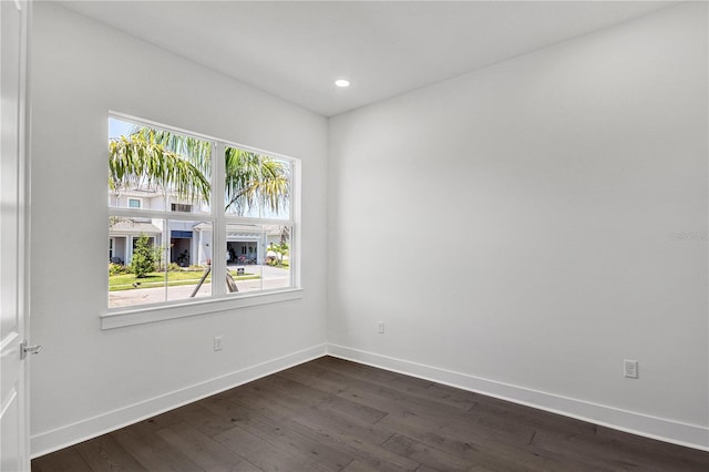 17723 Palmiste Dr, Bradenton, FL 34202 - empty room with plenty of natural light, dark wood-style floors, and recessed lighting