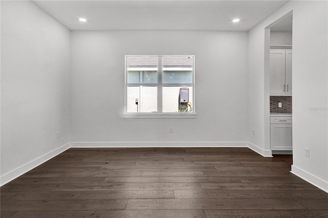 17723 Palmiste Dr, Bradenton, FL 34202 - empty room featuring dark wood-type flooring and recessed lighting