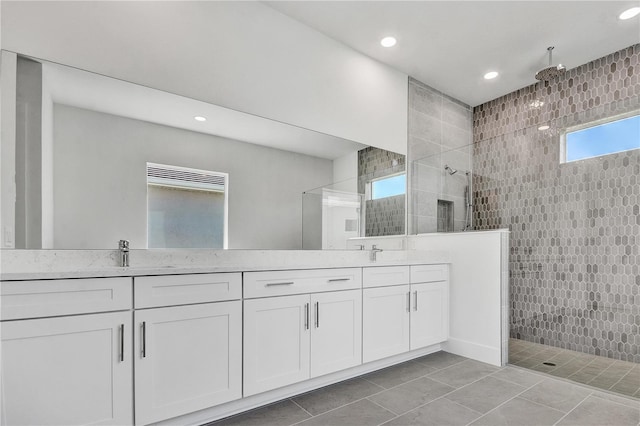 17723 Palmiste Dr, Bradenton, FL 34202 - bathroom featuring a walk in shower, double vanity, and recessed lighting