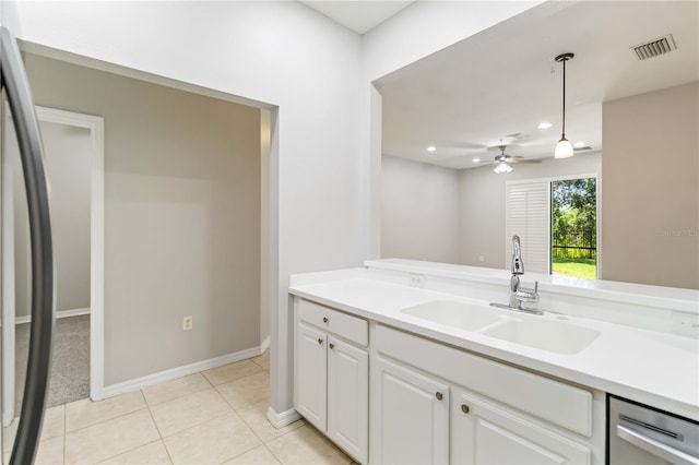4220 Via Piedra Cir Unit 4-101, Sarasota, FL 34233 - kitchen with stainless steel appliances, a sink, light countertops, white cabinets, and recessed lighting