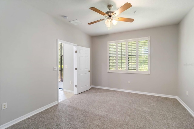 4220 Via Piedra Cir Unit 4-101, Sarasota, FL 34233 - unfurnished room featuring light colored carpet, ceiling fan, baseboards, and a smoke detector