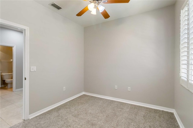 4220 Via Piedra Cir Unit 4-101, Sarasota, FL 34233 - spare room with ceiling fan, light colored carpet, and baseboards