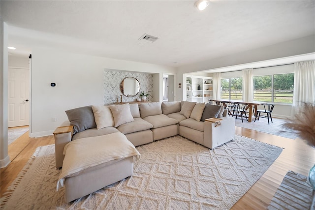 3810 Hidden River Rd, Sarasota, FL 34240 - living area with light wood-style flooring, baseboards, and recessed lighting