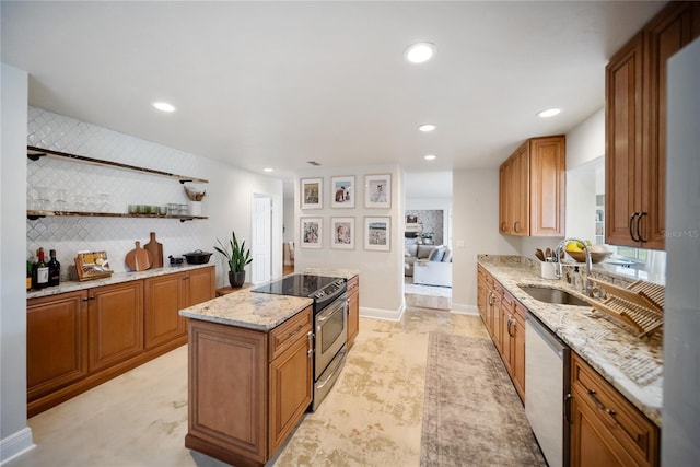 3810 Hidden River Rd, Sarasota, FL 34240 - kitchen with stainless steel appliances, a sink, a center island, light stone countertops, and open shelves