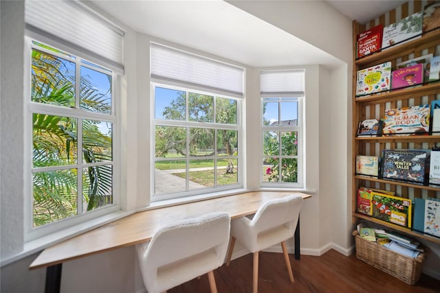 3810 Hidden River Rd, Sarasota, FL 34240 - dining space with wood finished floors, a desk, and baseboards