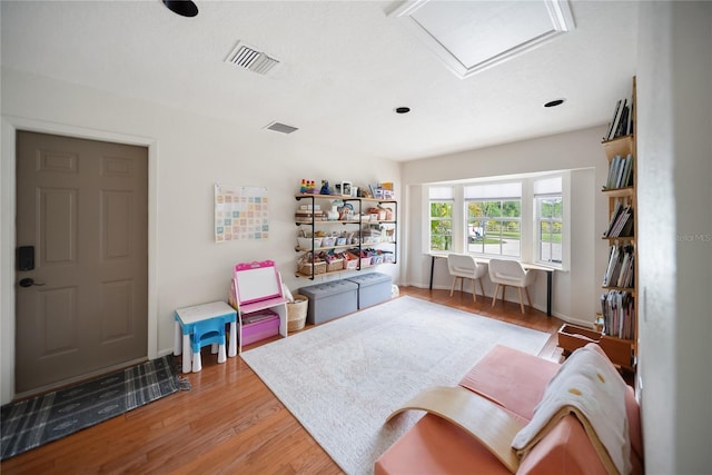 3810 Hidden River Rd, Sarasota, FL 34240 - living area featuring light wood-style flooring, attic access, and baseboards
