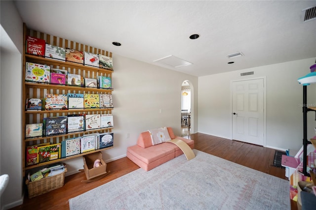 3810 Hidden River Rd, Sarasota, FL 34240 - living area featuring attic access, wood finished floors, and baseboards