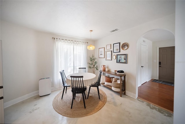 3810 Hidden River Rd, Sarasota, FL 34240 - dining space with arched walkways and baseboards