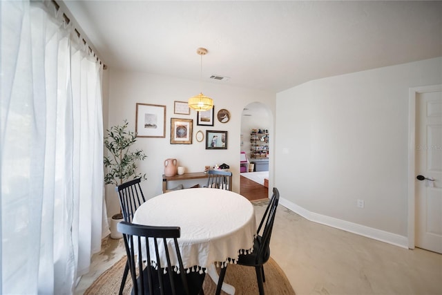 3810 Hidden River Rd, Sarasota, FL 34240 - dining space with arched walkways and baseboards