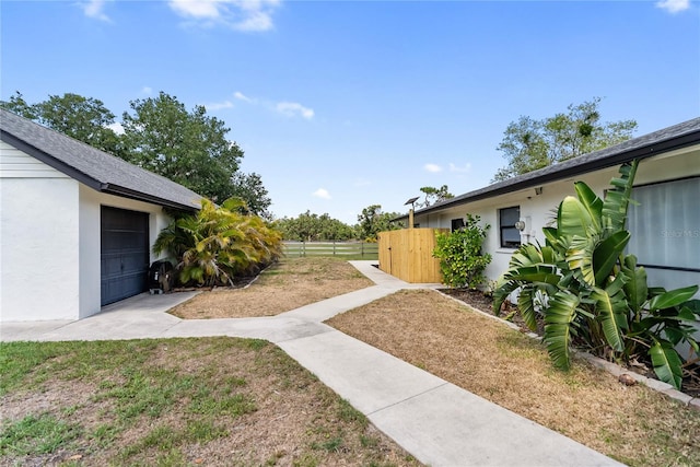 3810 Hidden River Rd, Sarasota, FL 34240 - view of yard featuring a garage