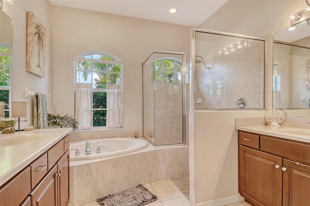 12358 Lavender Loop, Bradenton, FL 34212 - full bath with two vanities, healthy amount of natural light, a bath, and tiled shower