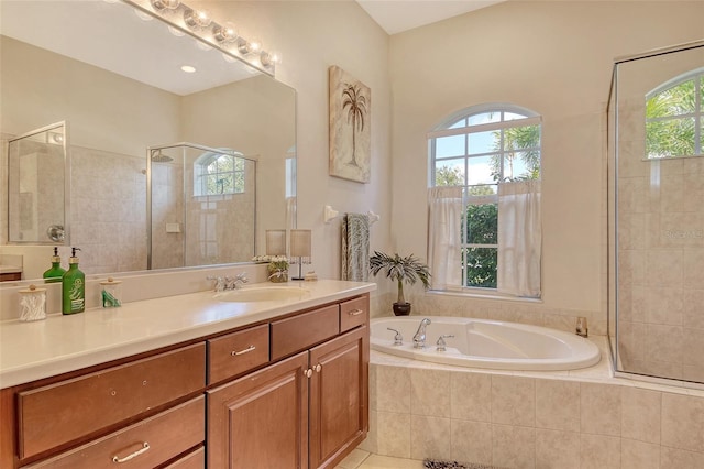 12358 Lavender Loop, Bradenton, FL 34212 - full bathroom with healthy amount of natural light, a garden tub, vanity, and tiled shower