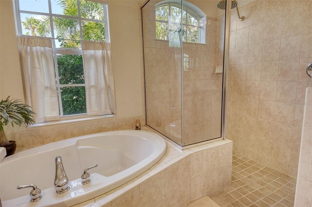 12358 Lavender Loop, Bradenton, FL 34212 - bathroom with a bath and tiled shower