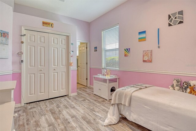 12358 Lavender Loop, Bradenton, FL 34212 - bedroom with light wood-style floors, baseboards, and a closet