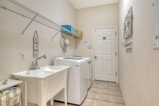 12358 Lavender Loop, Bradenton, FL 34212 - washroom with washing machine and clothes dryer, baseboards, and light tile patterned floors