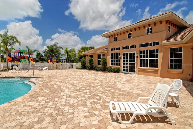 12358 Lavender Loop, Bradenton, FL 34212 - community pool with a patio and a playground