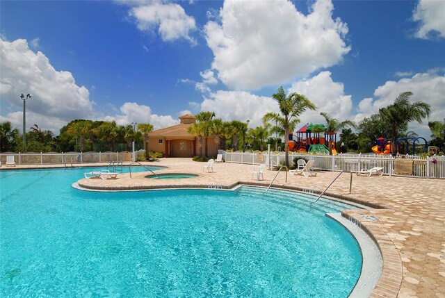 12358 Lavender Loop, Bradenton, FL 34212 - community pool featuring a hot tub and a patio