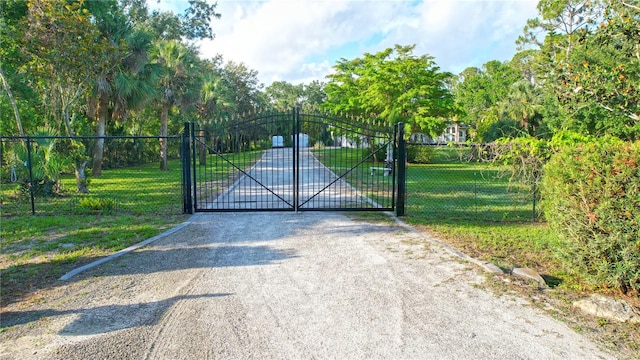 950 Trotter St, Nokomis, FL 34275 - gate with view of scattered trees