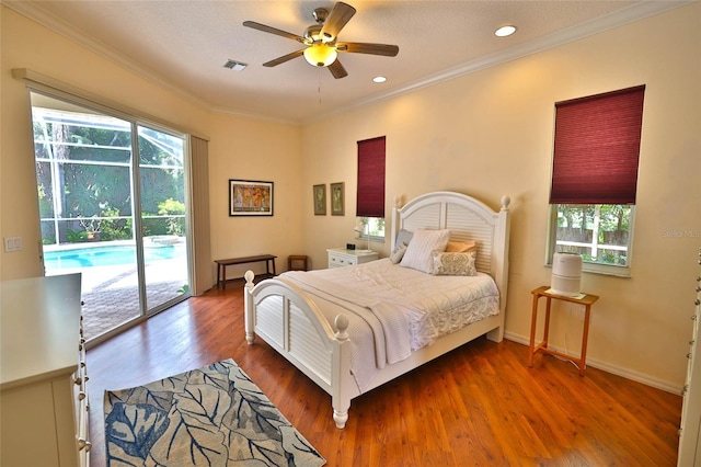 950 Trotter St, Nokomis, FL 34275 - bedroom with access to exterior, multiple windows, crown molding, wood finished floors, and a ceiling fan