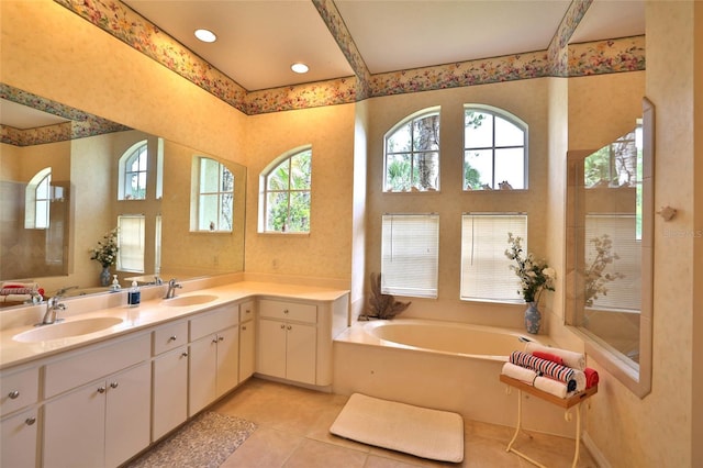 950 Trotter St, Nokomis, FL 34275 - bathroom with plenty of natural light, tile patterned flooring, a bath, and double vanity