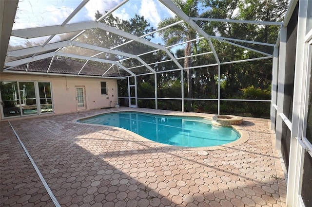 950 Trotter St, Nokomis, FL 34275 - view of swimming pool with a patio area, a pool with connected hot tub, and glass enclosure