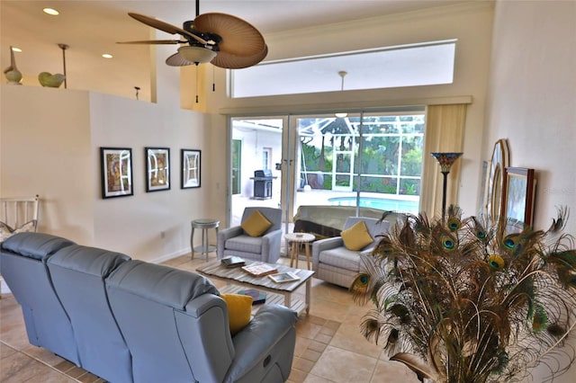950 Trotter St, Nokomis, FL 34275 - tiled living room featuring a ceiling fan, healthy amount of natural light, a towering ceiling, crown molding, and a sunroom