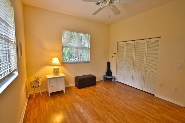 950 Trotter St, Nokomis, FL 34275 - unfurnished bedroom featuring light wood-style floors, baseboards, a ceiling fan, and a closet