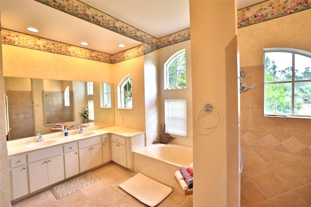 950 Trotter St, Nokomis, FL 34275 - full bath with a tile shower, a bath, tile patterned flooring, and vanity