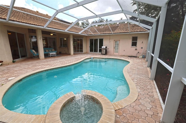950 Trotter St, Nokomis, FL 34275 - view of swimming pool with a patio area, grilling area, a pool with connected hot tub, and a lanai