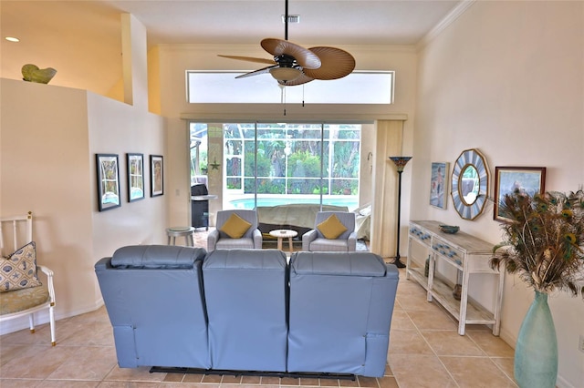 950 Trotter St, Nokomis, FL 34275 - living area with ceiling fan, light tile patterned floors, a towering ceiling, baseboards, and crown molding