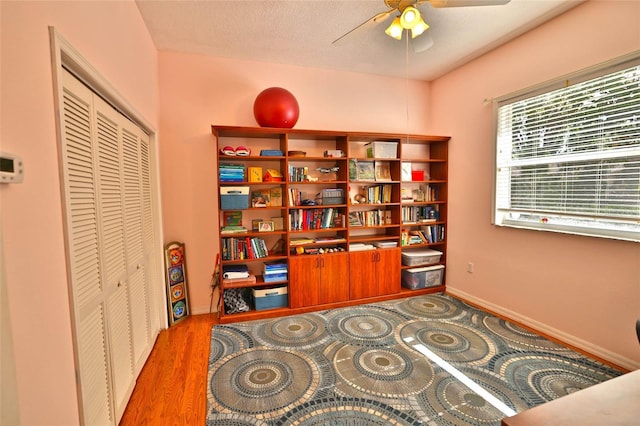 950 Trotter St, Nokomis, FL 34275 - office featuring a ceiling fan, baseboards, and wood finished floors