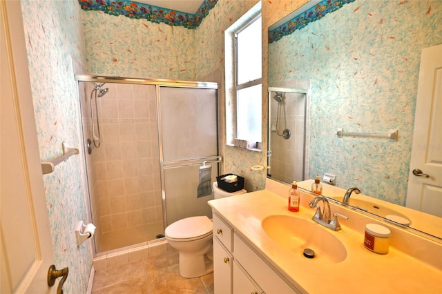 950 Trotter St, Nokomis, FL 34275 - bathroom with tile patterned flooring, a shower stall, wallpapered walls, vanity, and toilet