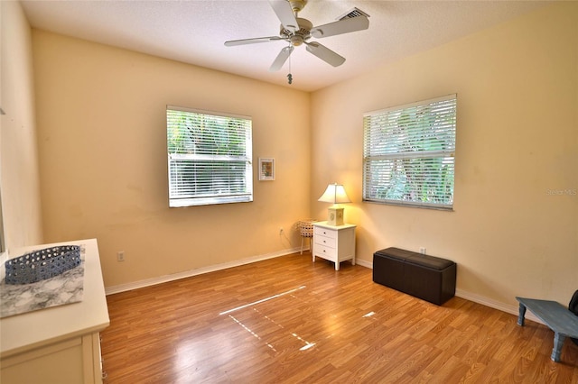 950 Trotter St, Nokomis, FL 34275 - unfurnished room with light wood-style flooring, ceiling fan, and baseboards