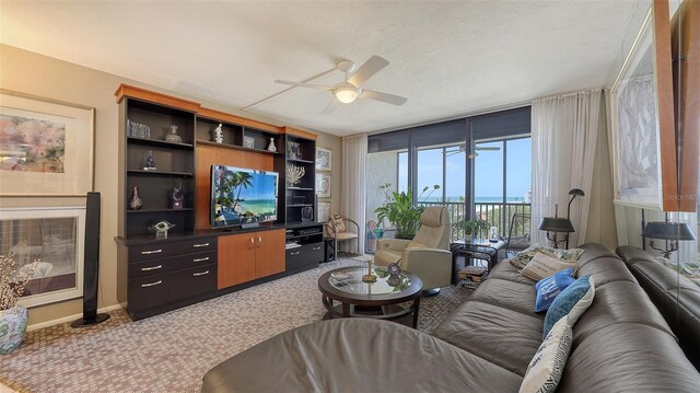 2045 Gulf Of Mexico Dr Unit M1-514, Longboat Key, FL 34228 - carpeted living room with ceiling fan and baseboards