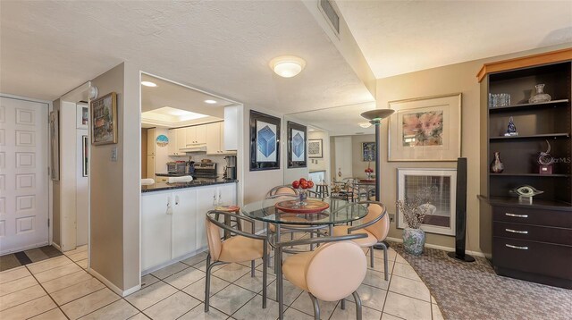 2045 Gulf Of Mexico Dr Unit M1-514, Longboat Key, FL 34228 - dining room featuring light tile patterned floors and baseboards