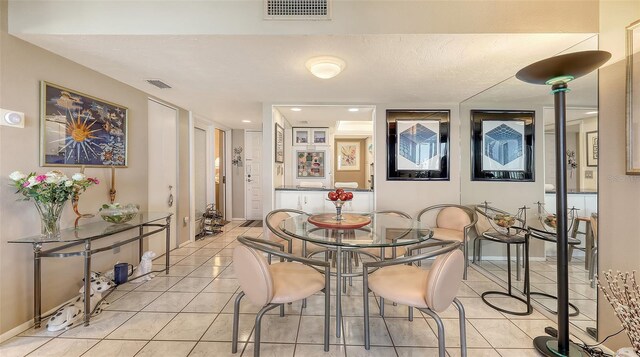 2045 Gulf Of Mexico Dr Unit M1-514, Longboat Key, FL 34228 - dining room featuring light tile patterned flooring