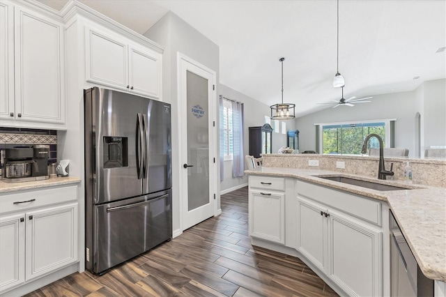 12755 Rainwashed Loop, Parrish, FL 34219 - kitchen with appliances with stainless steel finishes, a sink, tasteful backsplash, white cabinetry, and dark wood-type flooring