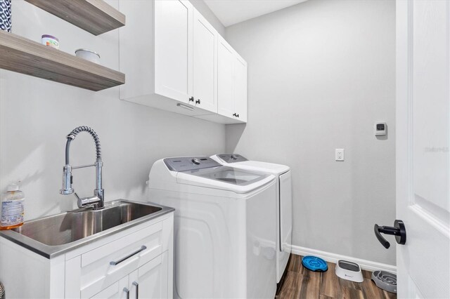 12755 Rainwashed Loop, Parrish, FL 34219 - laundry area with cabinet space, separate washer and dryer, dark wood-type flooring, and baseboards
