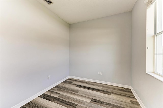 1721 Palm Warbler Ln, Ruskin, FL 33570 - unfurnished room featuring wood finished floors and baseboards