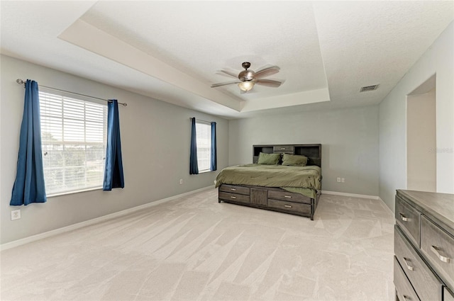 1721 Palm Warbler Ln, Ruskin, FL 33570 - bedroom with a raised ceiling, baseboards, light colored carpet, and ceiling fan