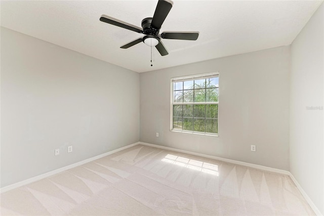 1721 Palm Warbler Ln, Ruskin, FL 33570 - empty room with light colored carpet, baseboards, and a ceiling fan