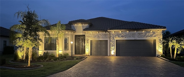 7327 Summerland Cv, Bradenton, FL 34202 - view of front facade featuring an attached garage and decorative driveway