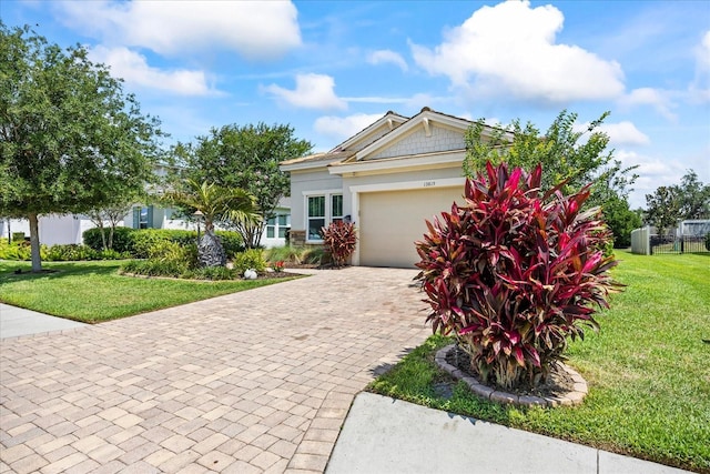 13819 American Prairie Pl, Bradenton, FL 34211 - view of front of property featuring a garage, decorative driveway, and stucco siding