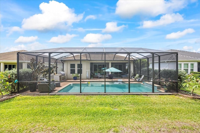 13819 American Prairie Pl, Bradenton, FL 34211 - back of house with a yard, an outdoor pool, and a patio