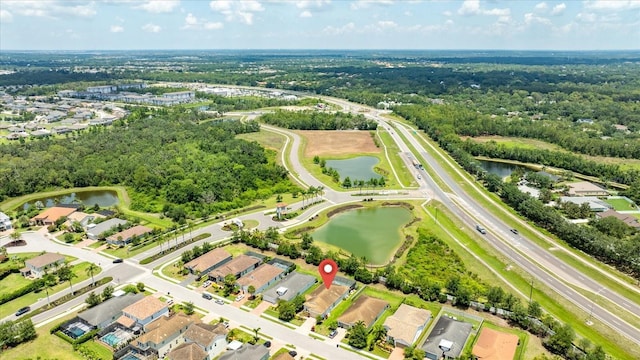 13819 American Prairie Pl, Bradenton, FL 34211 - aerial view of property and surrounding area with a large body of water and nearby suburban area
